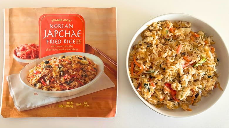Trader Joe's Korean Japchae Fried Rice in a bowl next to a bag on a white table