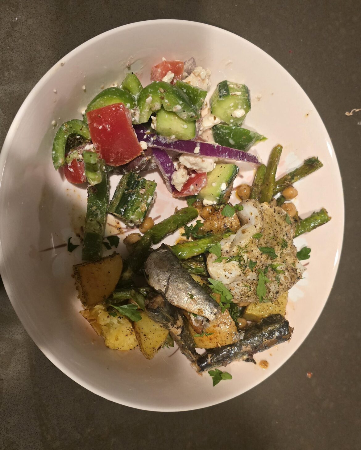 not super pretty but I made baked cod and sardines with ladolemono! also made an authentic Greek salad!