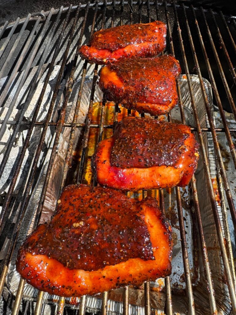 Smoked chicken thighs with macaroni and black beans.