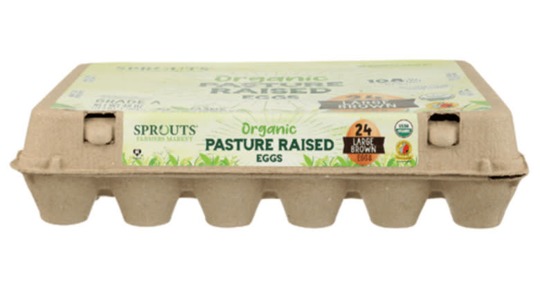 Carton of Sprouts Organic eggs on a white background