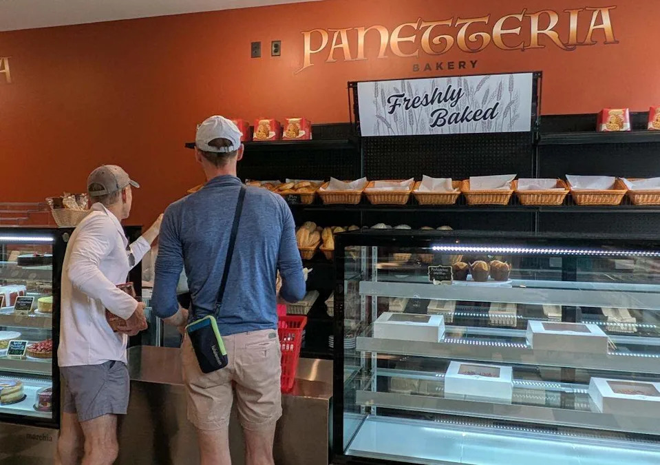Customers browse the bakery section at Enzo’s in Matthews.