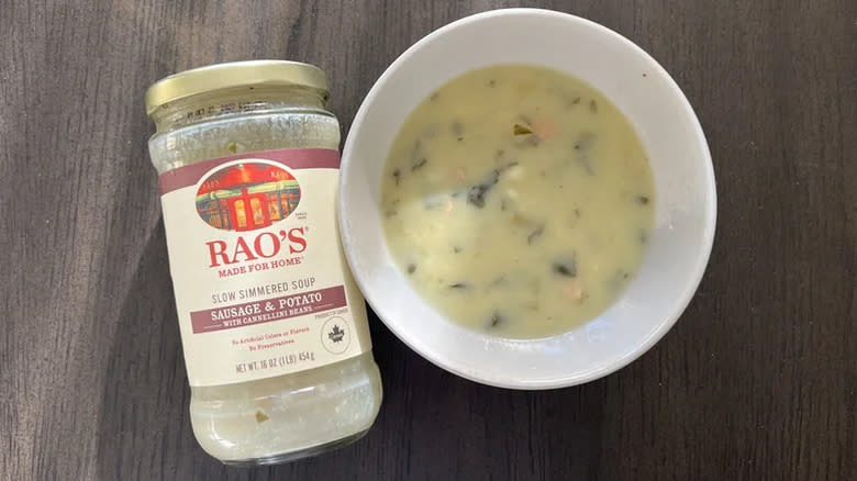 Rao's Sausage & Potato soup in a bowl next to empty jar