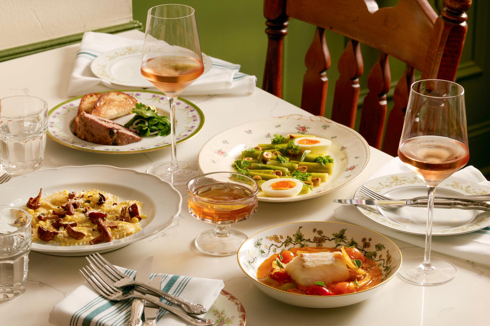Her Place table shot including their popular Corn Francobolli and Fish Dish. © Bre Furlong/ Her Place Supper Club