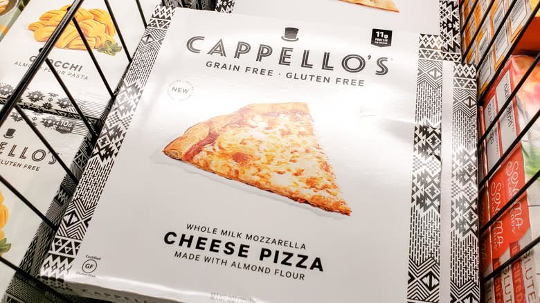 A Cappello's Pizza is displayed in a grocery store cold case