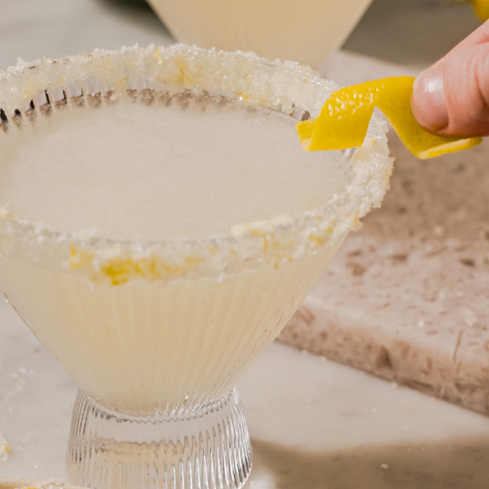 Cocktail with a sugared rim and lemon garnish