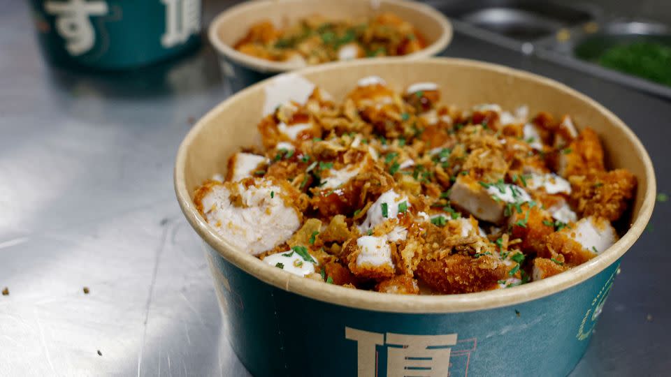 The Krousty Sabaïdi fast food chain has enticed French diners with a dish featuring fried chicken tenders served over rice, pictured above, which it claims to have invented. - Charlotte Siemon/AFP/Getty Images