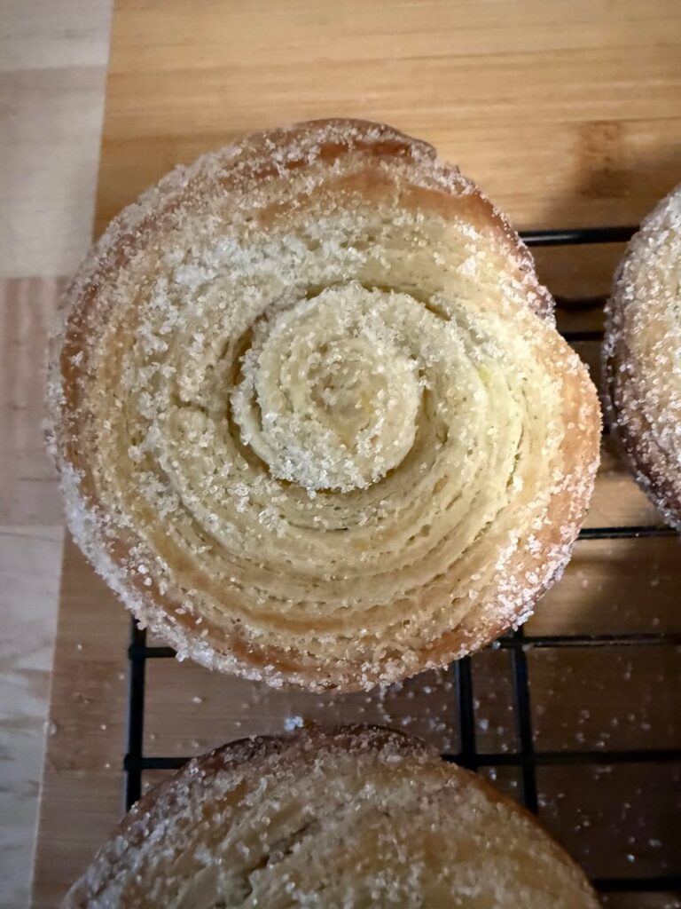 Fun with lamination! Morning buns scented with orange zest and vanilla and rolled in sugar while still warm.