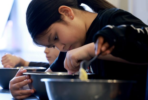 Sasha, 11, makes pasta from scratch during a cooking class at the Schoolhouse Kitchen + Studio in Chicago on March 25, 2026. (Antonio Perez/Chicago Tribune)