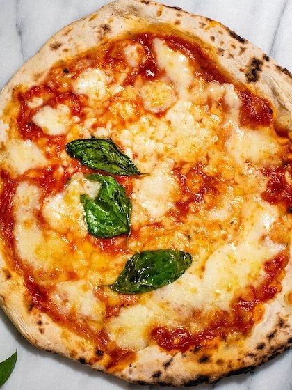 Image may contain: Food, Pizza, Dish, Meal, and Bread