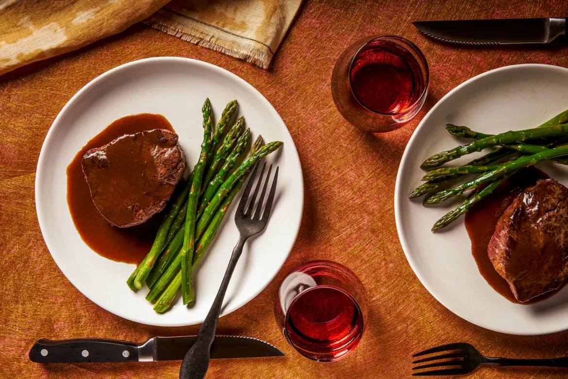 Bring the steakhouse home with recipes for filet mignon, creamed spinach, Baked Alaska and more