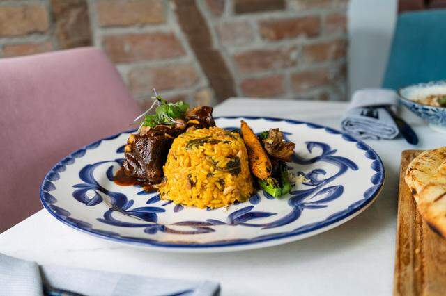 The fresh flavors of the Mediterranean are displayed in this dish of rice, beef and carrots at Field’s Mediterranean in downtown Biloxi.