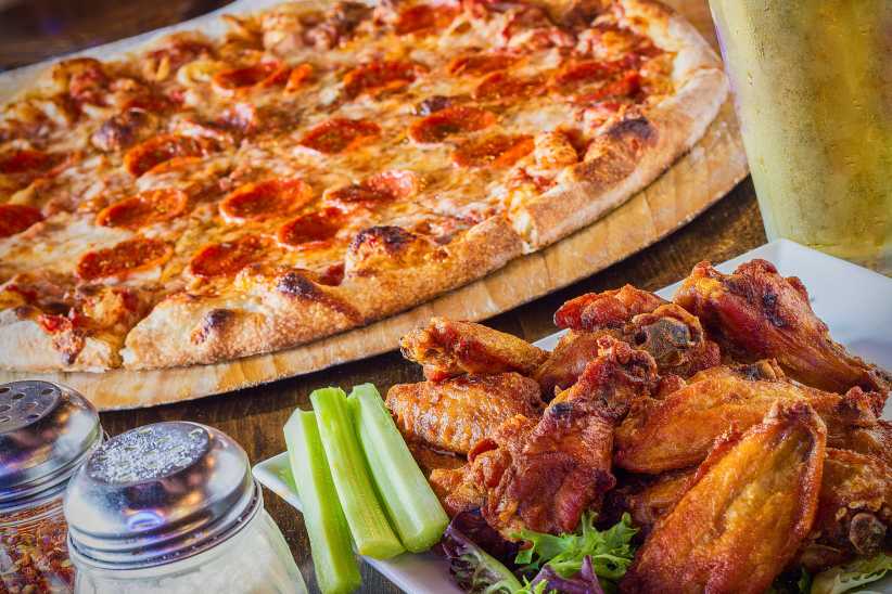 pepperoni pizza with buffalo chicken wings The Best Pizza Spots in Westchester Right Now,