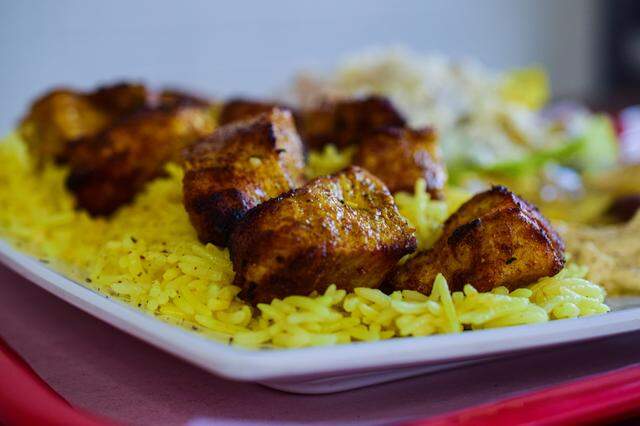 The chicken kabob was juicy and served over a generous portion of turmeric rice with garlic sauce, homemade hummus, salad and pita.