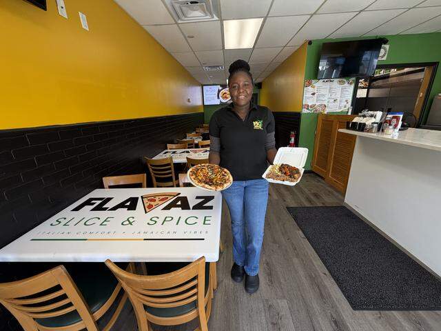 Delaney Hawkins-Shaw, owner of Flavaz Slice & Spice, located at 3306 Manatee Ave. W. in Bradenton, holds up some dishes that go with the new restaurant’s “Italian comfort, Jamaican vibes,” slogan.