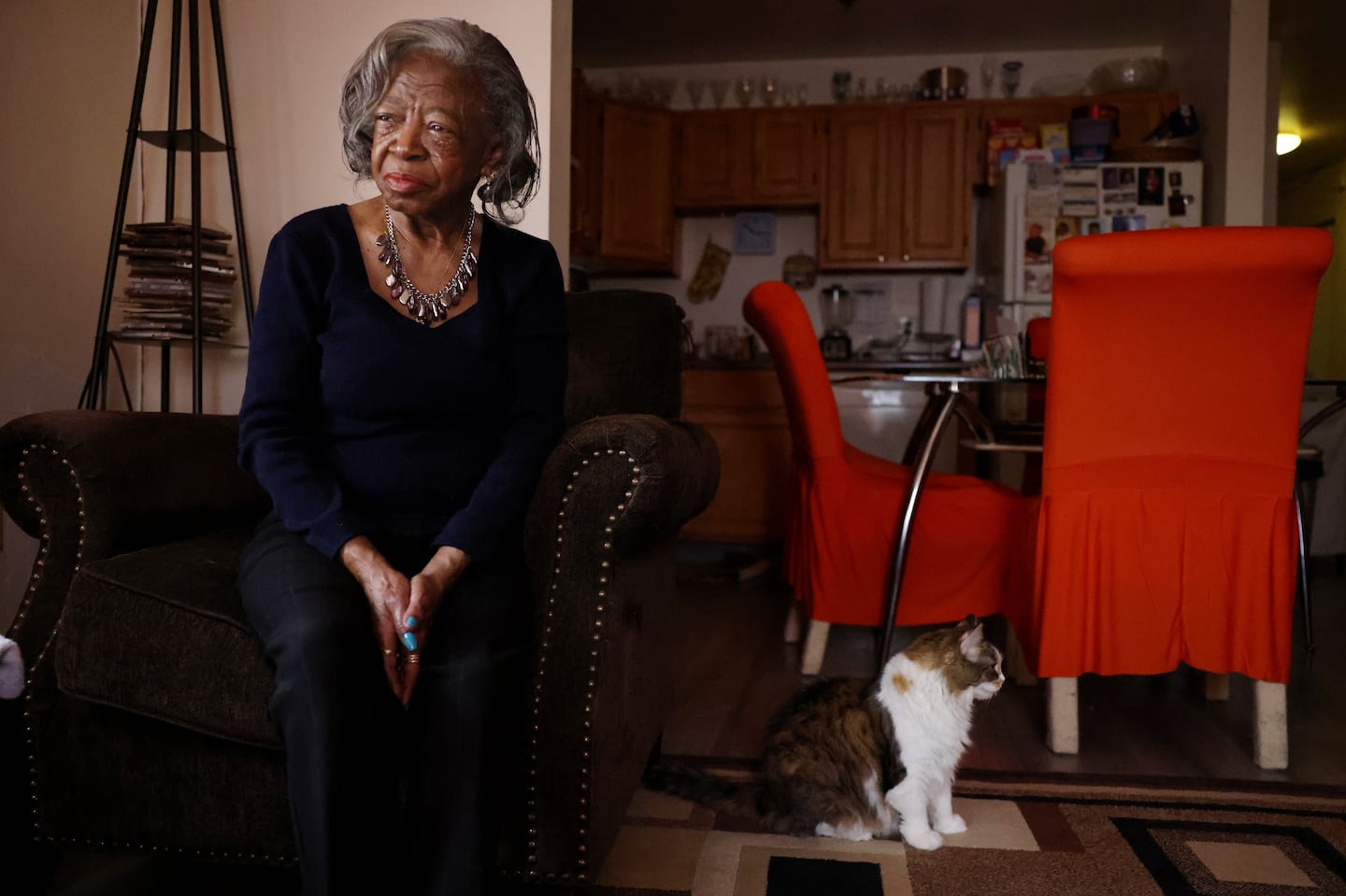 Betty Strickland, 73, a retired receptionist poses for a portrait beside her cat Leah at home in Dorchester.