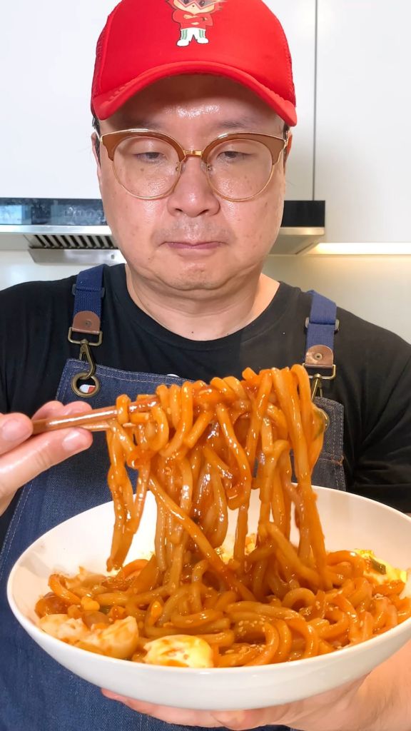 Korean Style Spicy and Sweet Udon Stir Fry with Boiled Egg on Top Korean Style Spicy and Sweet Udon Stir Fry with Boiled Egg on Top