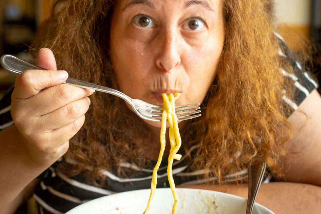 Mindi slurps on Cacio e Pepe at Piatto Romano in Rome