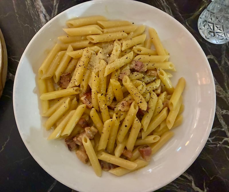 A plate of penne carbonara