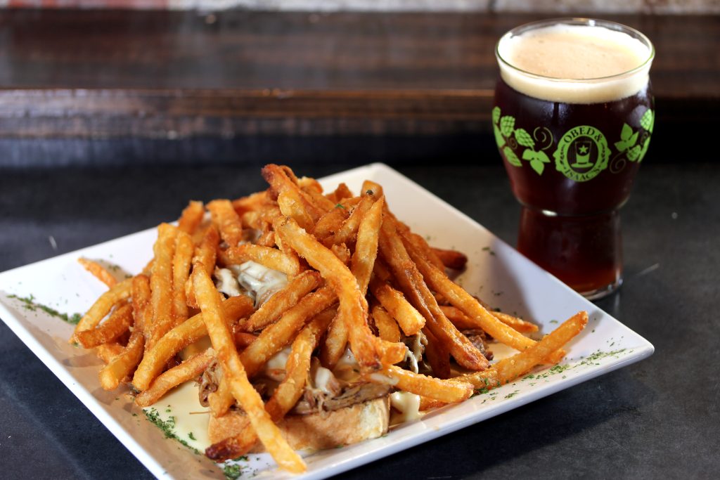 A horseshoe sandwich at Obed and Isaac’s Brewery in Springfield: hamburger, cheese sauce and fries piled on Texas toast.