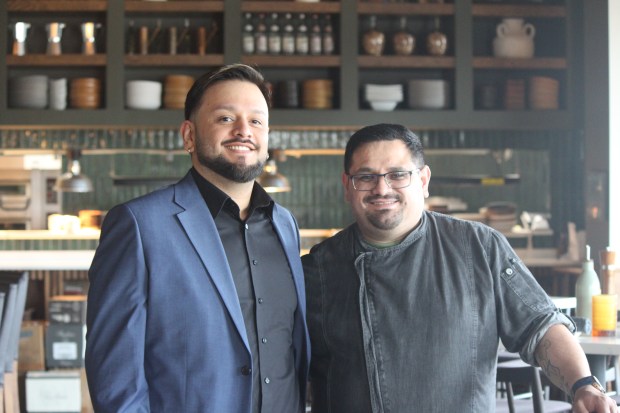 From left: General Manager Lalo Prado stands next to Chef Juan Ramirez, a co-owner of Ovvio Italian Taverna. Ramirez makes all of the restaurant's pizza and pasta dough in-house from scratch every morning, April 3, 2026. (Claire Murphy/Pioneer Press)
