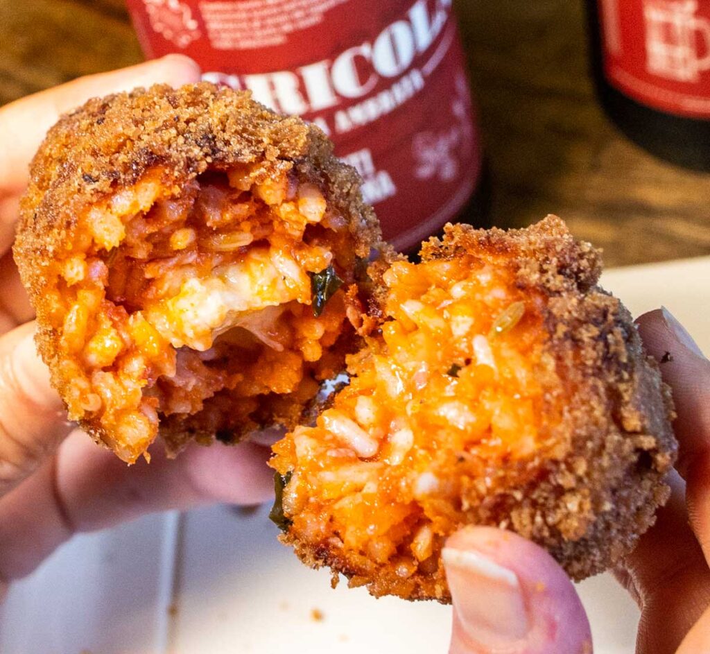 Suppli pulled in half at Supplizio in Rome