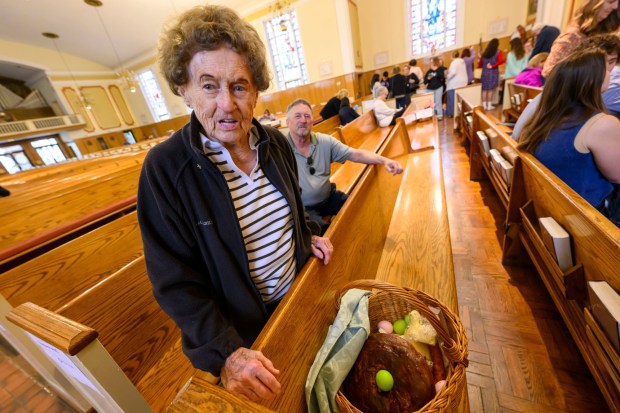 Mary Stofanak Rzucidlo, 92, of Bethlehem shows her Easter basket filled with food Saturday, April 4, 2026, to be blessed by Rev. Giuseppe Esposito on Holy Saturday at St. Anne Catholic Church in Bethlehem. Stofanak Rzucidlo has been getting her Easter baskets blessed since she was 8 years old. (April Gamiz/The Morning Call)