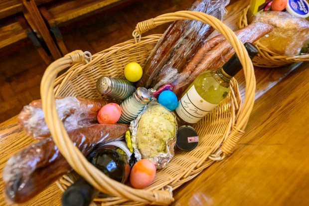 Jim and Sandy Yackanicz of Bethlehem included salt and pepper to be blessed Saturday, April 4, 2026, during a blessing of the food baskets on Holy Saturday at St. Anne Catholic Church in Bethlehem. (April Gamiz/The Morning Call)