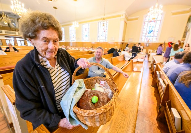 Mary Stofanak Rzucidlo, 92, of Bethlehem shows her Easter basket filled with food Saturday, April 4, 2026, to be blessed by Rev. Giuseppe Esposito on Holy Saturday at St. Anne Catholic Church in Bethlehem. Stofanak Rzucidlo has been getting her Easter baskets blessed since she was 8 years old. (April Gamiz/The Morning Call)