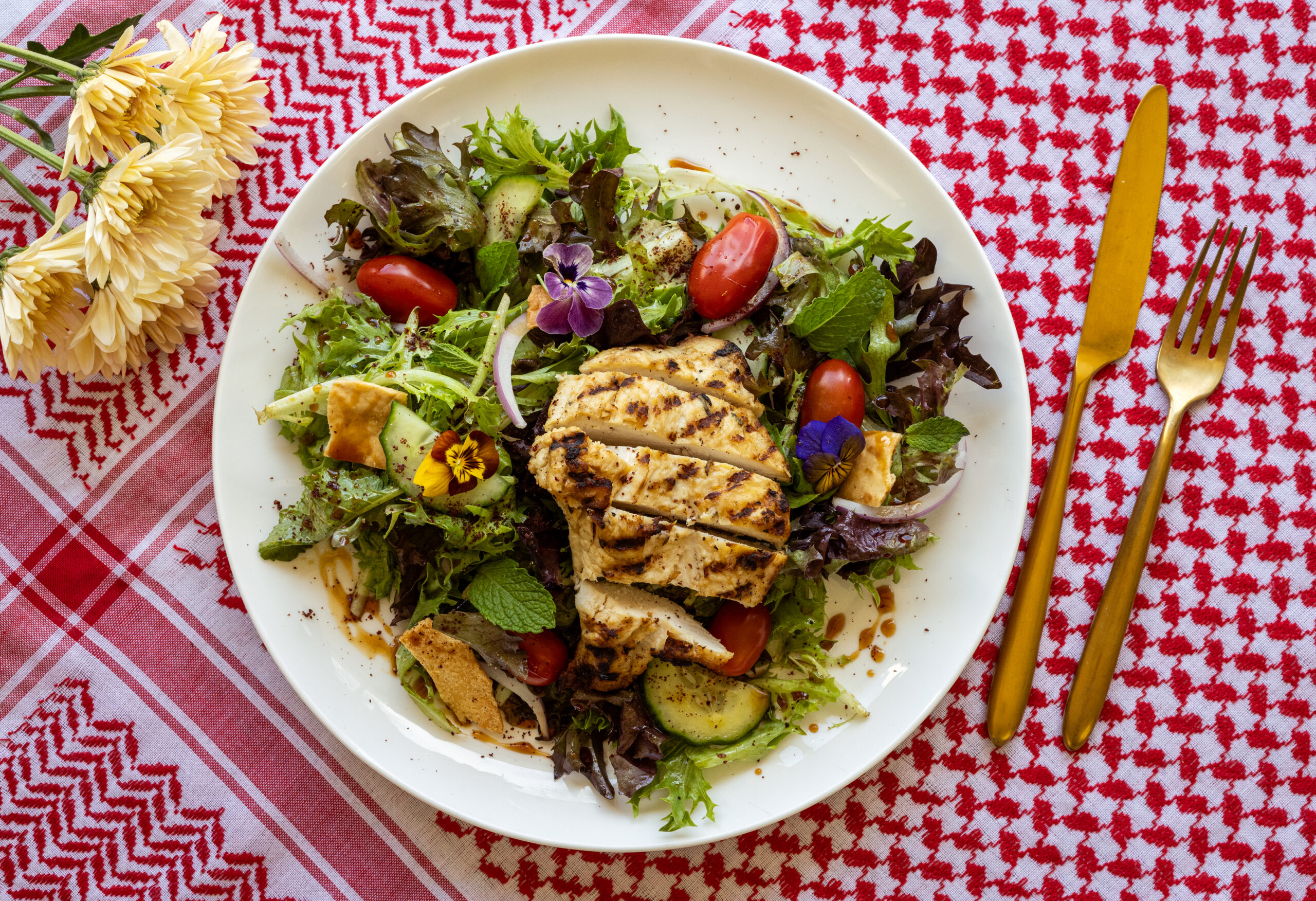 Fattoush with grilled chicken, tomato, cucumber, onion, mint, sumac and crispy pita from the lunch-only menu at Mazza Levantine Kitchen Thursday, March 26, 2026 in northeast Petaluma. (John Burgess / The Press Democrat)