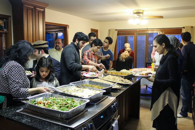 The family gathers in Toledo, Ohio for family dinner, where Iman Sediqe is often tasked with making the coveted Borani Banjan, a fried eggplant dish in tomato sauce and garlicky yogurt, that's been passed down for generations.