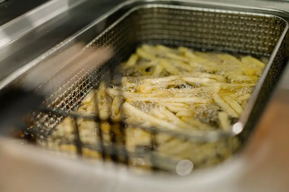 Close Up, ,process,of,cooking,french,fries,in,a,professional