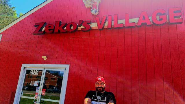 Owner Sam Leo stands outside Zeko’s Village Italian Family Restaurant in Denver near Lake Norman.