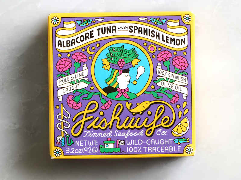 Colorful packaging for albacore tuna with Spanish lemon, featuring floral designs and text about sourcing and ingredients.