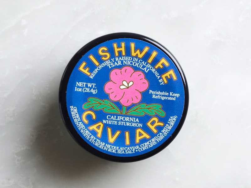 Caviar container labeled "Fishwife" with a pink flower design, indicating California white sturgeon.