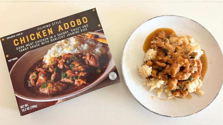 Trader Joe's Chicken Adobo on a plate next to a box on a white table