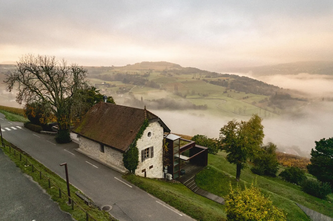 Les Morainières in Jongieux, France, overlooking a foggy valley.