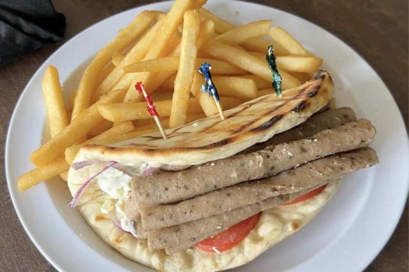 The Greek gyro is one of dozens of items on the menu at Trofi, a new Mediterranean restaurant in Idaho Falls. It’s a flat bread pita stuffed with a combination of beef and lamb, tomato, red onion and tzatziki, a cucumber yogurt dip. On the side, is an order of authentic Mediterranean fries from Lamb Weston in American Falls (there’s a story behind that, which you can hear in the video above). | Rett Nelson, EastIdahoNews.com