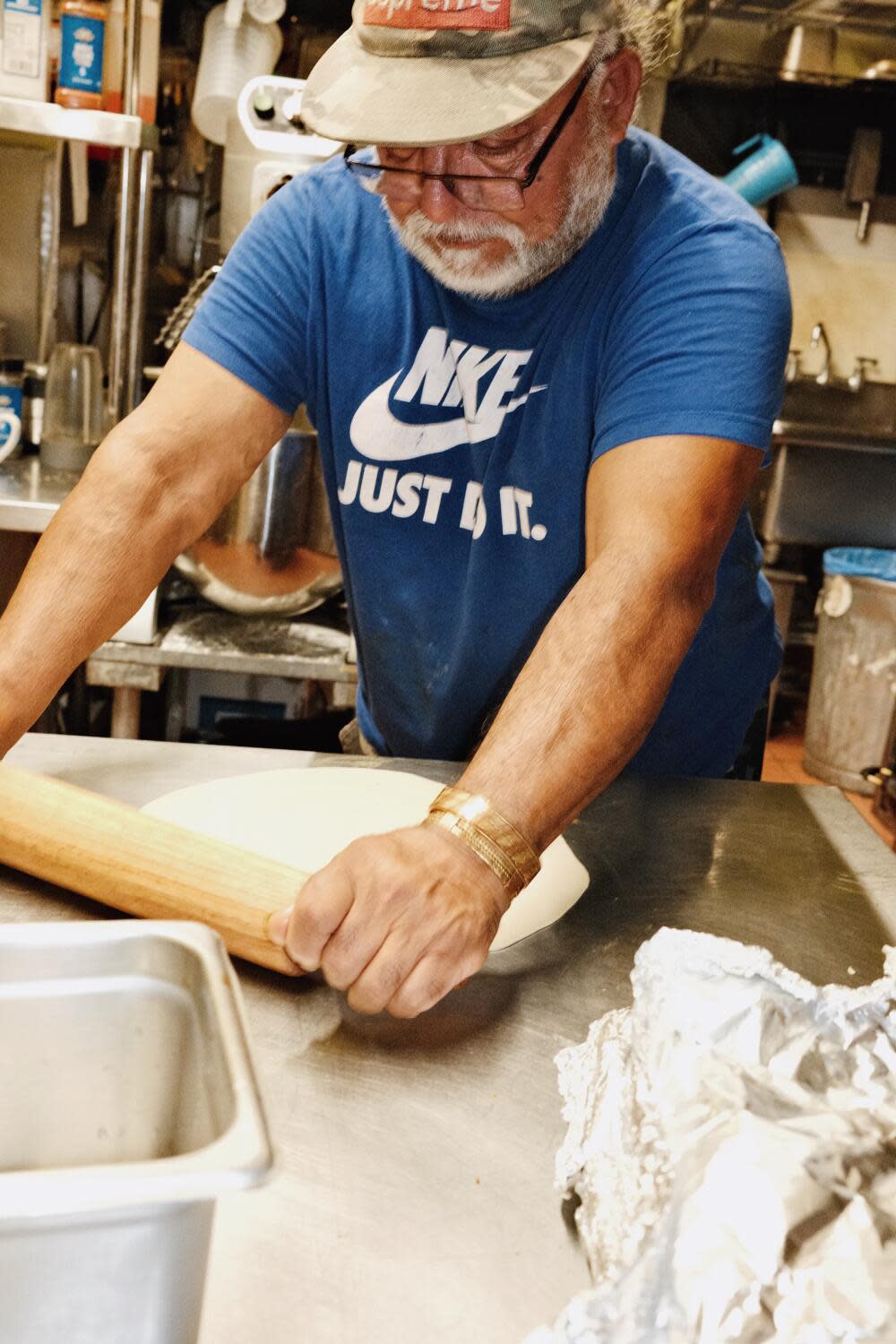 Chef-owner Abul Ibrahim rolls fresh roti at Roshana Bilash.