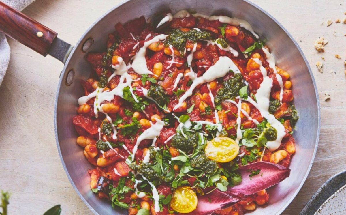 a pan of baked shakshuka with butter beans and aubergine for most popular breakfast recipes