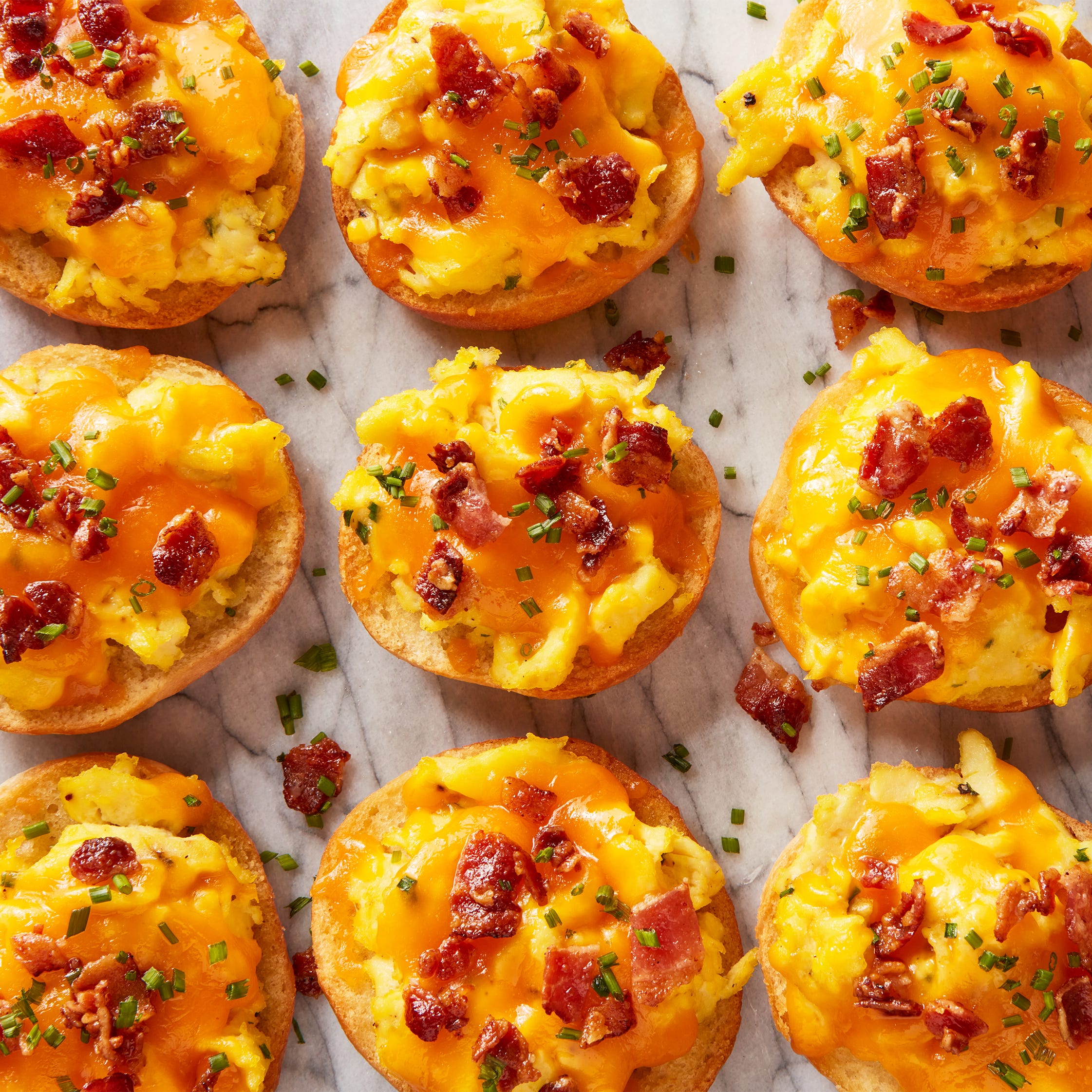 breakfast bagel bites topped with cheese and bacon
