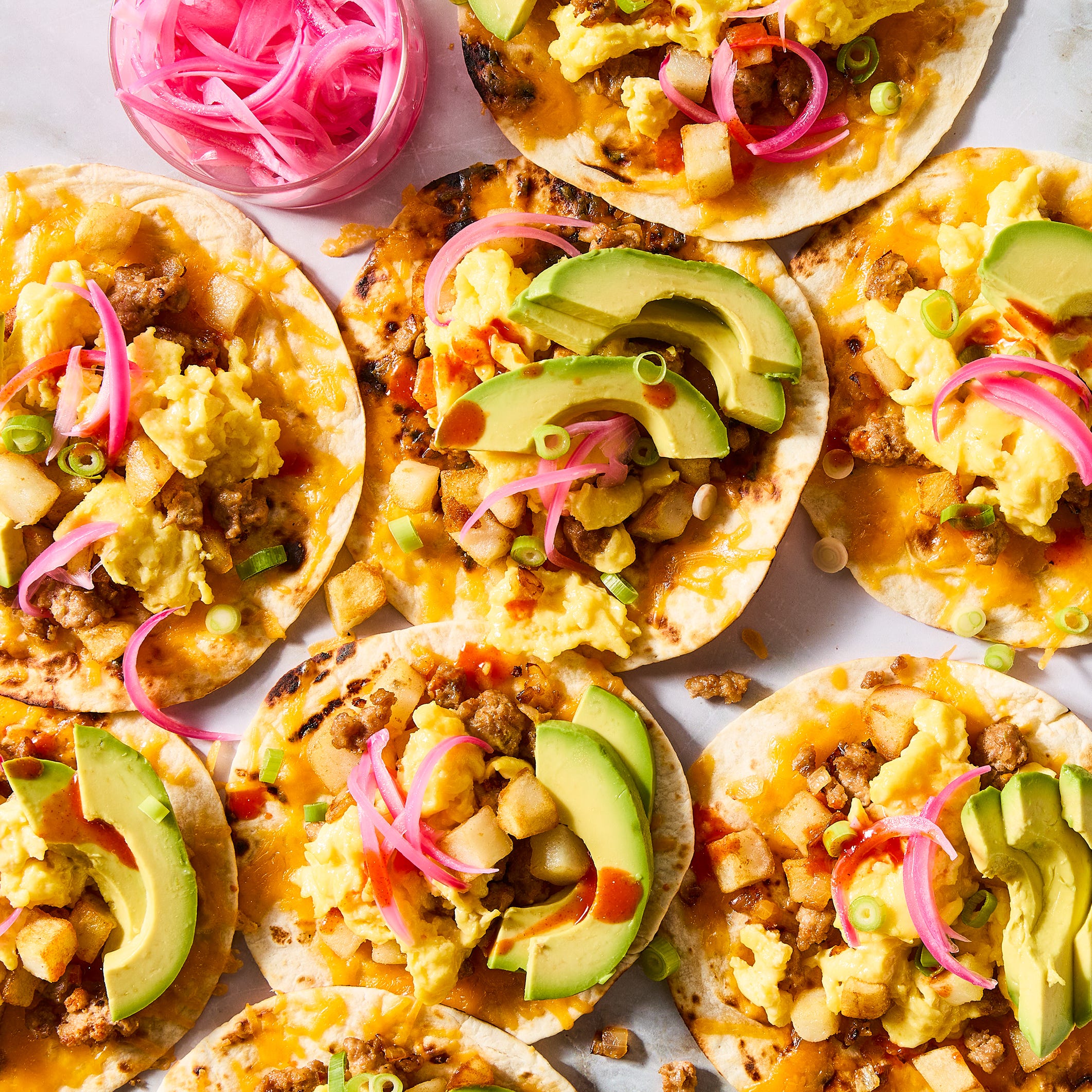 breakfast tacos topped with avocado