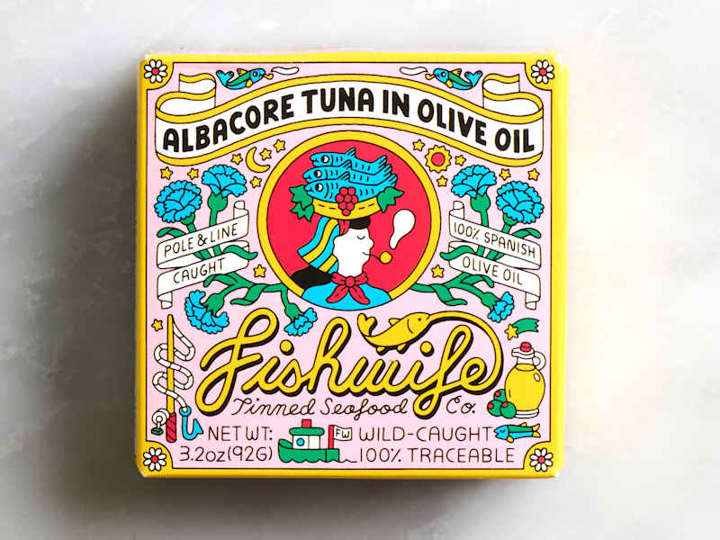 Colorful packaging for albacore tuna in olive oil, featuring illustrations of fish, flowers, and decorative text.