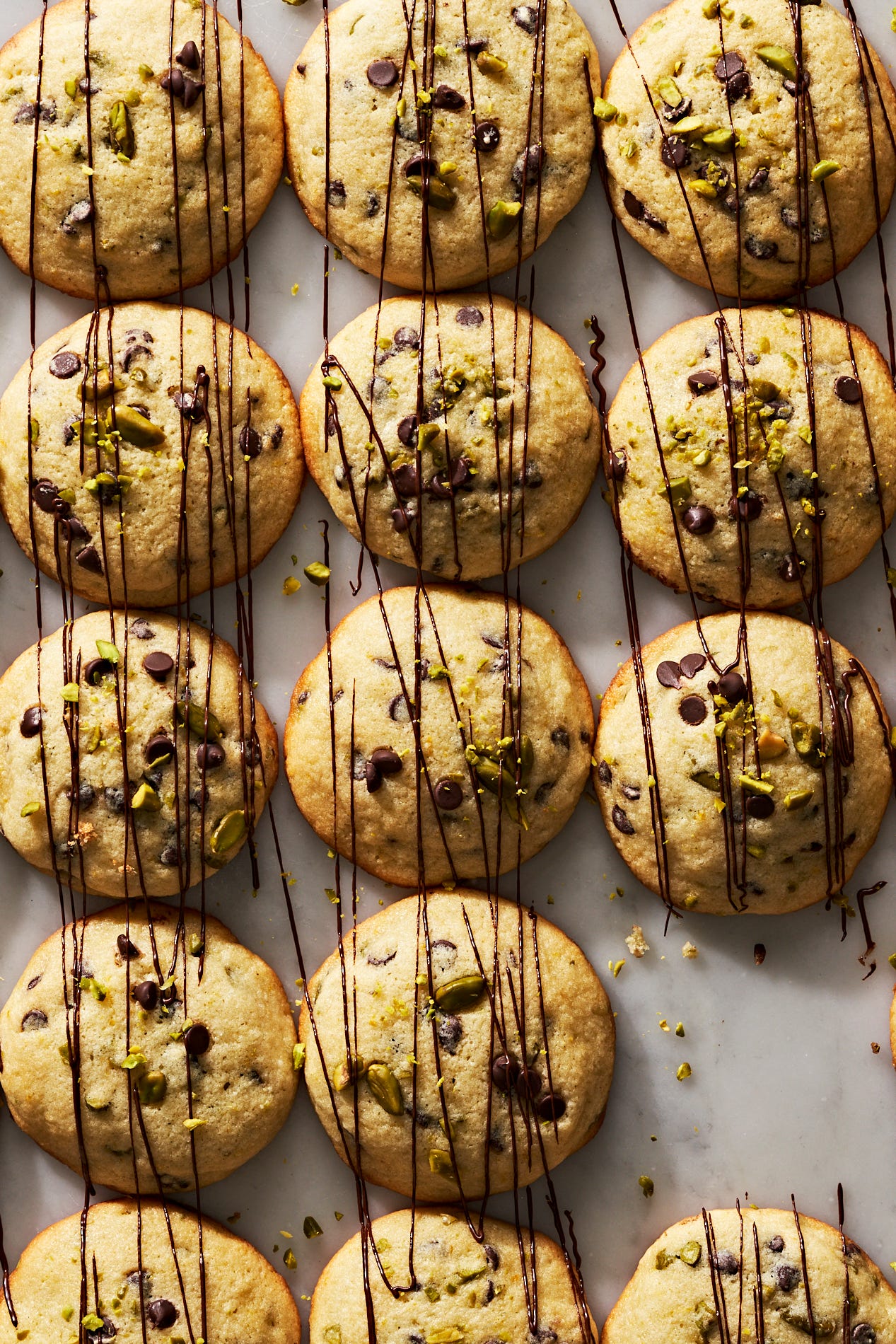 cannoli cookies with chocolate chips and pistachios, drizzled with chocolate