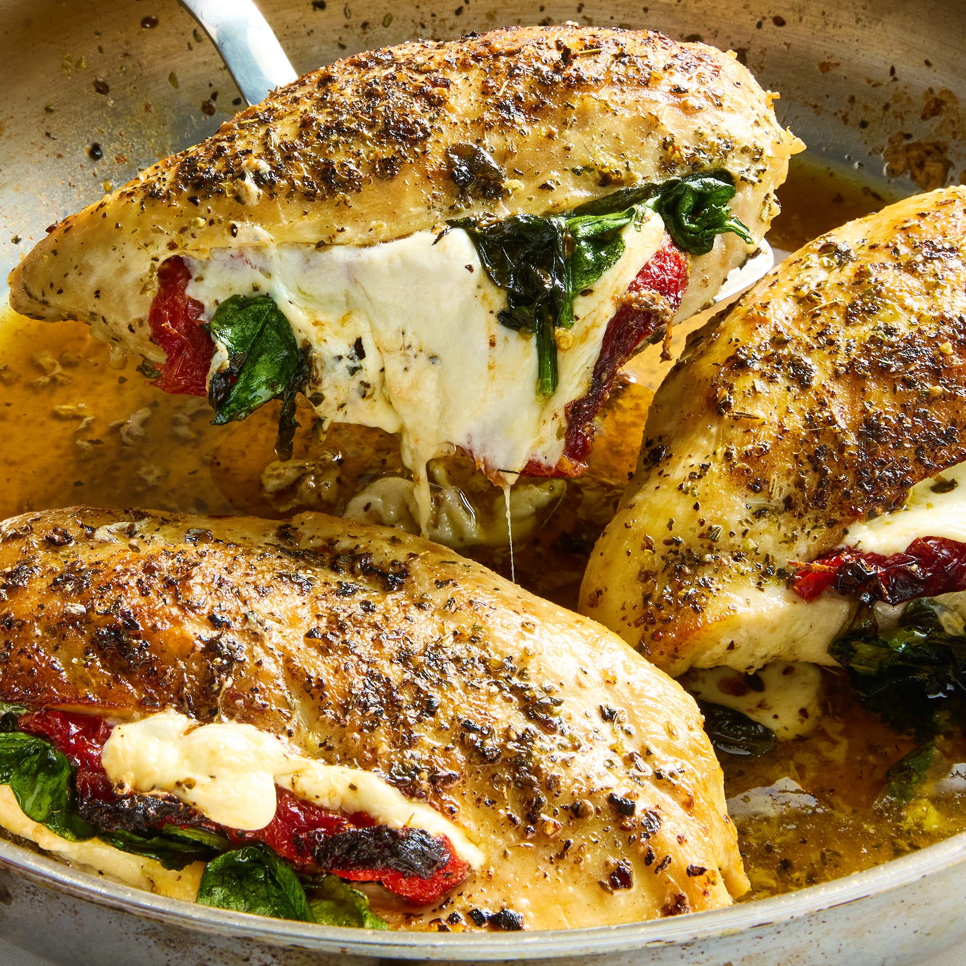 chicken breasts sliced and stuffed with mozzarella cheese, sun dried tomatoes and spinach