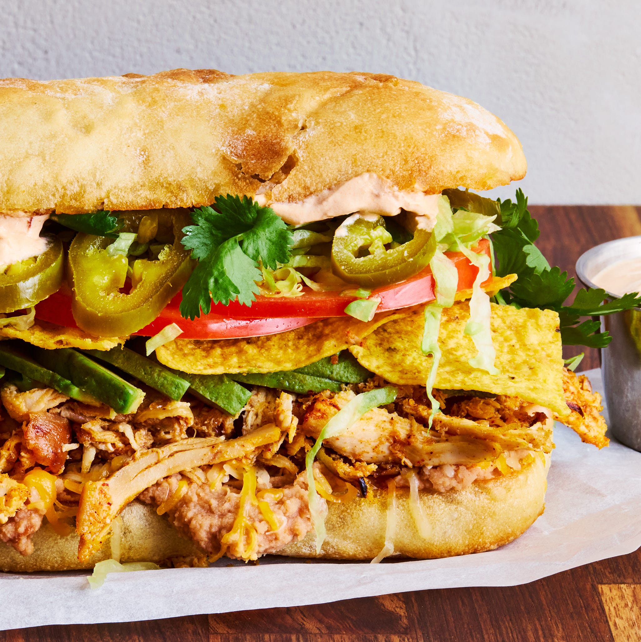 shredded chicken, veggies, and tortilla chips between two slices of bread
