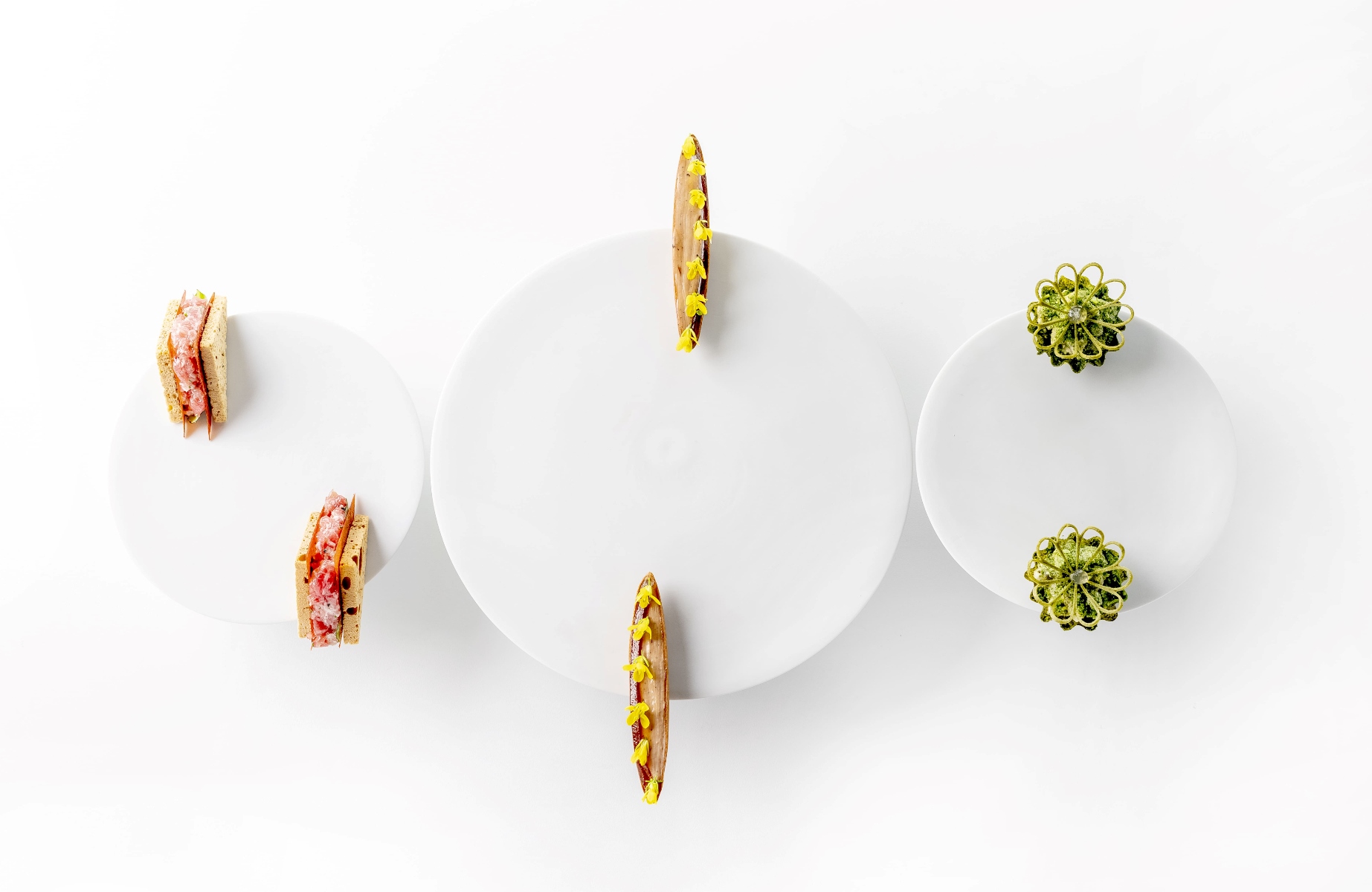 A trio of starters at Evvai, showcasing bold, vibrant flavors executed with finesse. © Tadeu Bruneli/Evvai