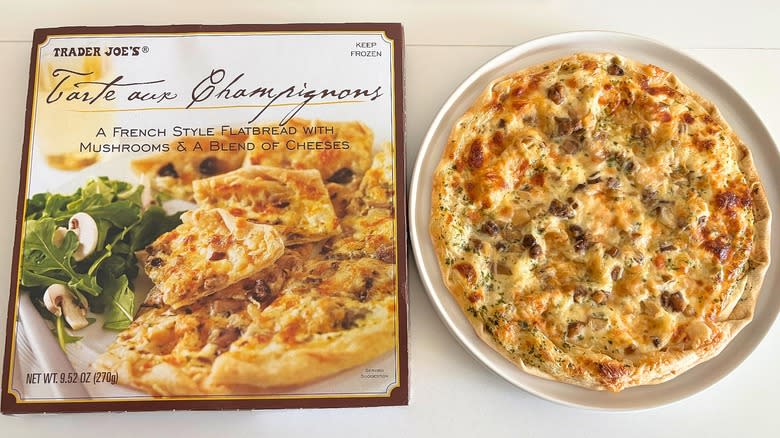 Trader Joe's Tarte Aux Champignons on a white plate next to a box on a white table