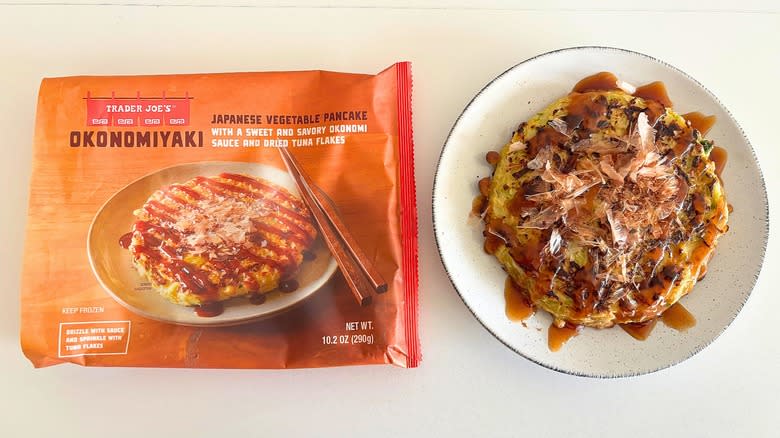Trader Joe's Okonomiyaki on a plate next to packaging on a white table