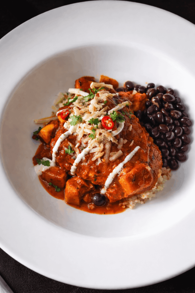 Bean burrito with black bean and panner gravy. Sub rice with quinoa.