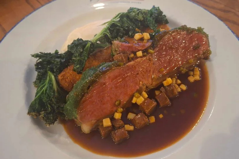 Herb-Crusted Lamb Saddle with crisp shoulder, celeriac purée, kalettes and sauce reform